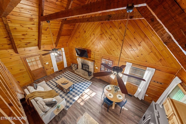4372 Boogertown Rd Unit 2, Sevierville, TN 37876 - living room featuring ceiling fan, wooden walls, wood finished floors, a fireplace, and wood ceiling