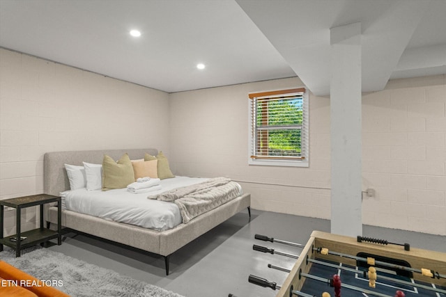 4372 Boogertown Rd Unit 2, Sevierville, TN 37876 - bedroom with concrete block wall, recessed lighting, and concrete flooring