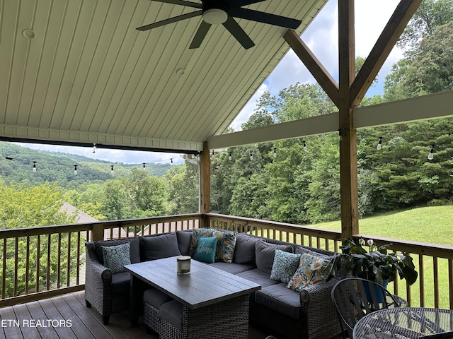 667 Pine Hollow Rd, Jacksboro, TN 37757 - wooden terrace with an outdoor living space, a ceiling fan, and a forest view