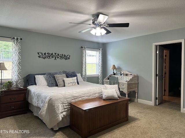 667 Pine Hollow Rd, Jacksboro, TN 37757 - carpeted bedroom featuring a ceiling fan and a textured ceiling
