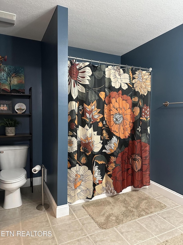 667 Pine Hollow Rd, Jacksboro, TN 37757 - bathroom featuring a textured ceiling, a shower with shower curtain, and tile patterned floors