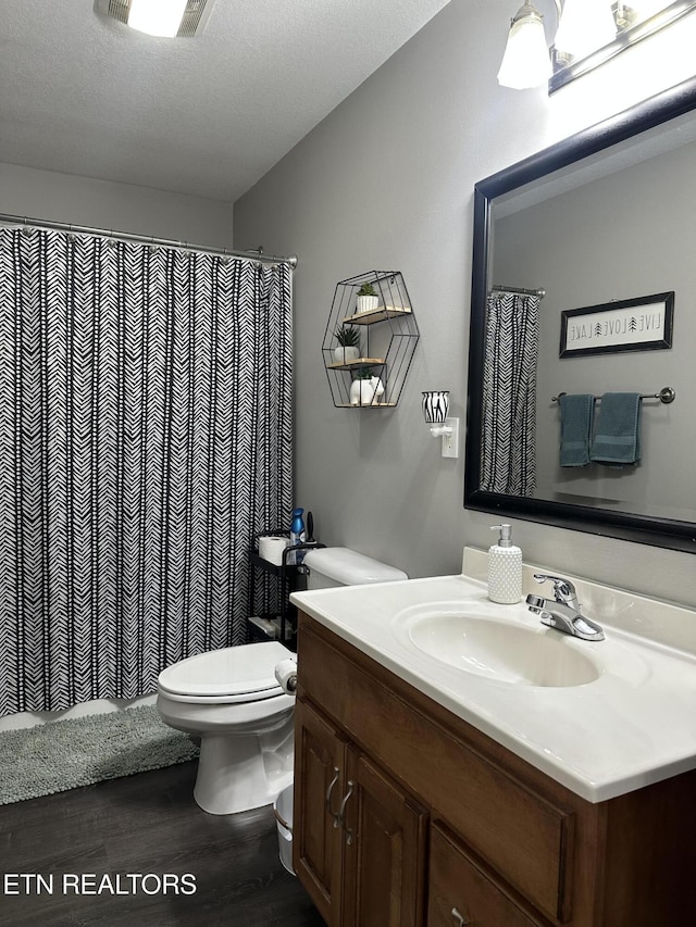 667 Pine Hollow Rd, Jacksboro, TN 37757 - full bathroom with wood finished floors, vanity, and curtained shower