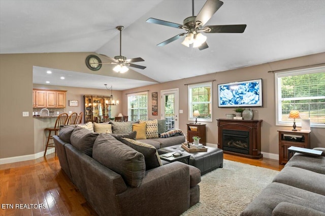 667 Pine Hollow Rd, Jacksboro, TN 37757 - living area with light wood-type flooring, lofted ceiling, a ceiling fan, healthy amount of natural light, and a fireplace
