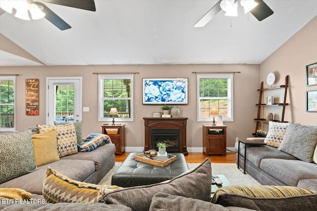 667 Pine Hollow Rd, Jacksboro, TN 37757 - living room featuring a ceiling fan, vaulted ceiling, and light wood-style flooring