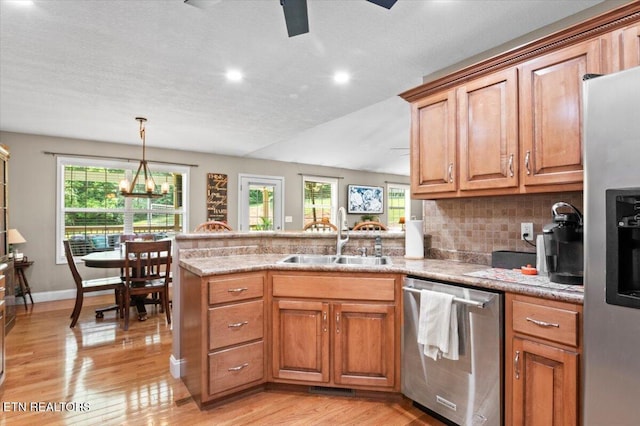 667 Pine Hollow Rd, Jacksboro, TN 37757 - kitchen with appliances with stainless steel finishes, a peninsula, light wood-style flooring, plenty of natural light, and recessed lighting