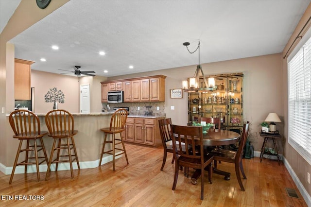 667 Pine Hollow Rd, Jacksboro, TN 37757 - dining area with light wood-style flooring, ceiling fan, recessed lighting, and a chandelier