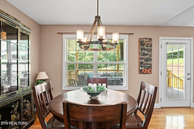 667 Pine Hollow Rd, Jacksboro, TN 37757 - dining area featuring a chandelier, healthy amount of natural light, and light wood finished floors