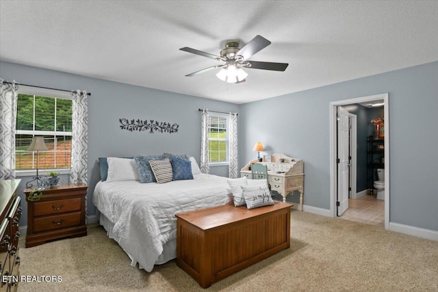 667 Pine Hollow Rd, Jacksboro, TN 37757 - bedroom featuring light carpet, ceiling fan, and ensuite bath