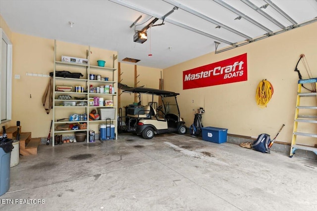 667 Pine Hollow Rd, Jacksboro, TN 37757 - garage featuring a garage door opener