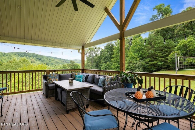 667 Pine Hollow Rd, Jacksboro, TN 37757 - wooden terrace featuring an outdoor living space, a ceiling fan, and outdoor dining space