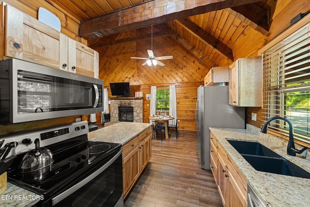 4372 Boogertown Rd Unit 4, Sevierville, TN 37876 - kitchen featuring stainless steel appliances, wooden ceiling, wood walls, light brown cabinetry, and ceiling fan