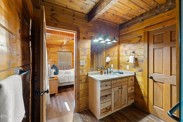4372 Boogertown Rd Unit 4, Sevierville, TN 37876 - bathroom with a wooden ceiling with exposed beams, ensuite bath, wood walls, vanity, and wood finished floors