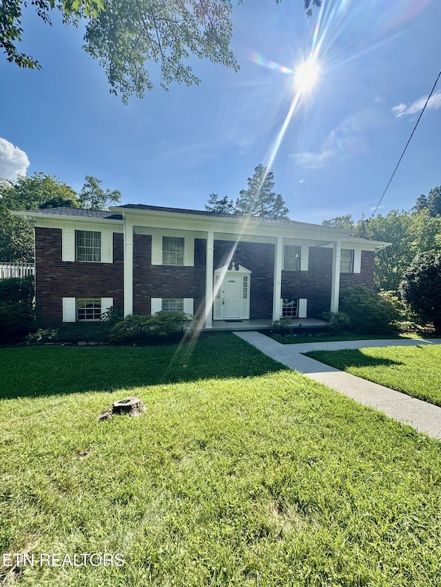 121 Ida Hertzler Ln, Knoxville, TN 37934 - view of front facade with a front yard and brick siding