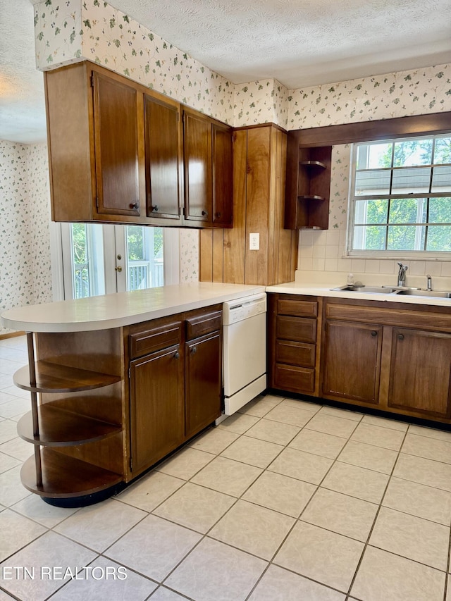 121 Ida Hertzler Ln, Knoxville, TN 37934 - kitchen with open shelves, wallpapered walls, white dishwasher, a textured ceiling, and light countertops