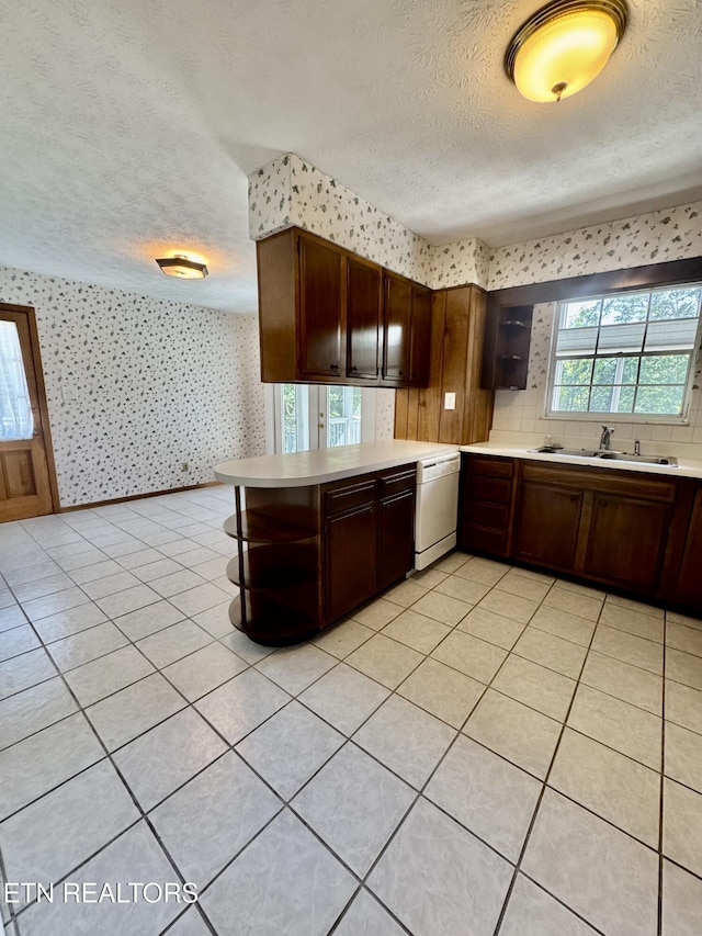 121 Ida Hertzler Ln, Knoxville, TN 37934 - kitchen featuring wallpapered walls, a textured ceiling, dishwasher, open shelves, and light countertops