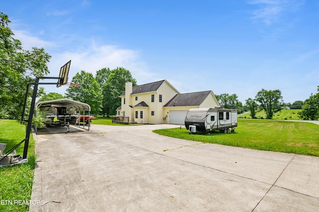 201 Locust Dr, Lafollette, TN 37766 - view of side of home featuring driveway, a yard, a detached carport, and a chimney