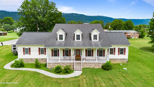 201 Locust Dr, Lafollette, TN 37766 - new england style home featuring a porch, a mountain view, a front yard, and a shingled roof