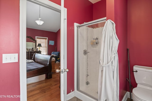 201 Locust Dr, Lafollette, TN 37766 - ensuite bathroom featuring a stall shower and wood finished floors