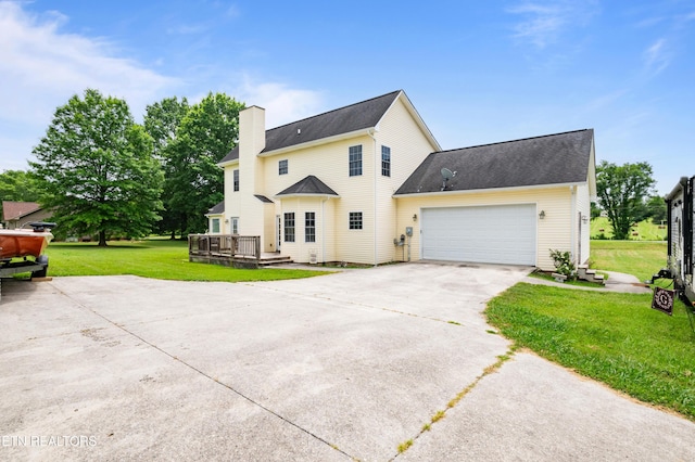 201 Locust Dr, Lafollette, TN 37766 - back of house with driveway, a garage, a yard, a wooden deck, and a chimney