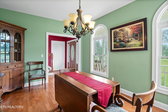 201 Locust Dr, Lafollette, TN 37766 - dining room featuring wood finished floors, a chandelier, and plenty of natural light