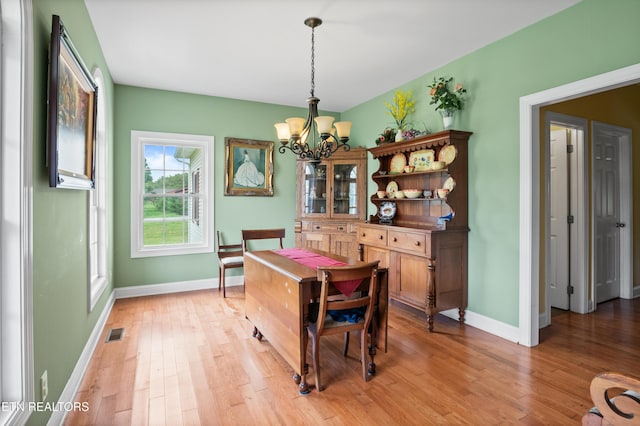 201 Locust Dr, Lafollette, TN 37766 - dining area featuring a chandelier and light wood-style flooring