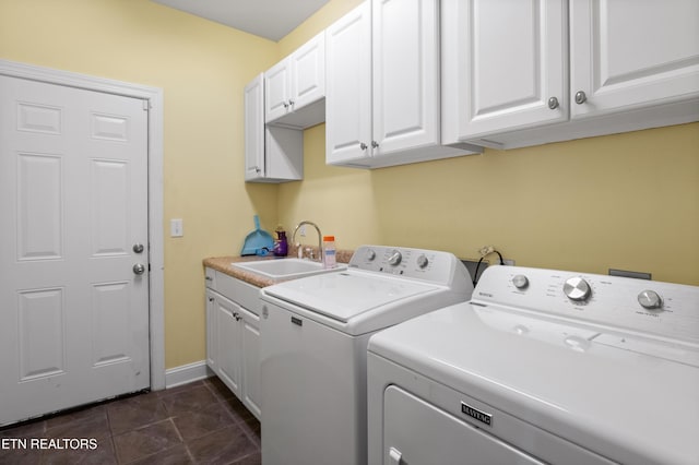 201 Locust Dr, Lafollette, TN 37766 - washroom with separate washer and dryer, cabinet space, and dark tile patterned floors