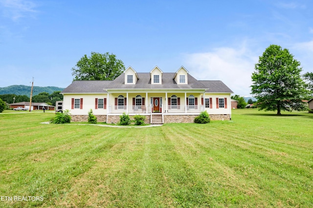 201 Locust Dr, Lafollette, TN 37766 - cape cod home featuring a porch, a front lawn, and a mountain view