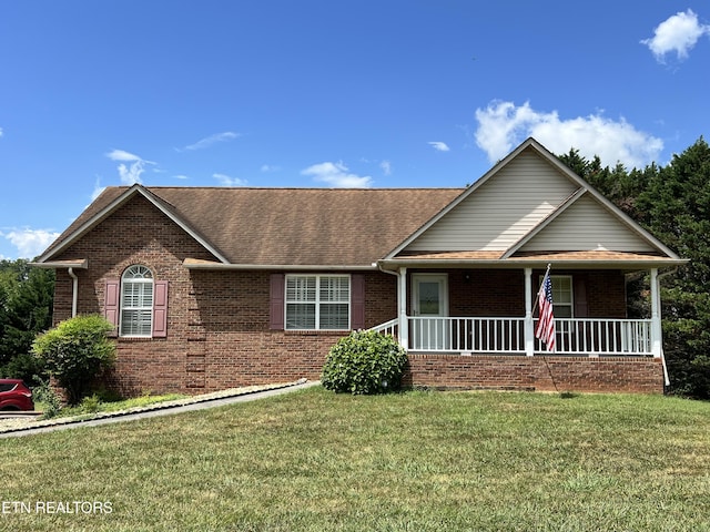 1367 Warrior, Maryville, TN 37803 - view of front facade with brick siding, a shingled roof, a front lawn, and covered porch