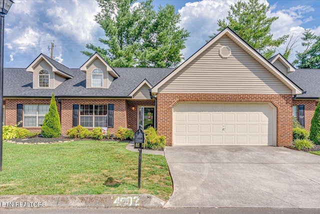 4802 Beverly Field Way, Knoxville, TN 37918 - view of front of home featuring brick siding, driveway, a garage, and a front yard