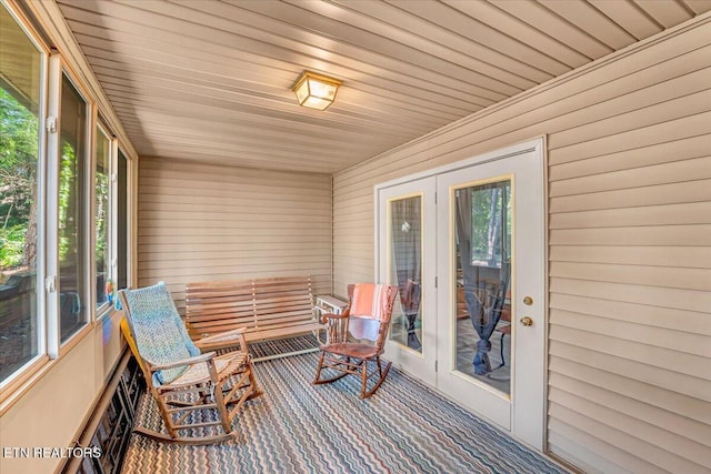 4802 Beverly Field Way, Knoxville, TN 37918 - sunroom / solarium with carpet flooring, wooden walls, and french doors