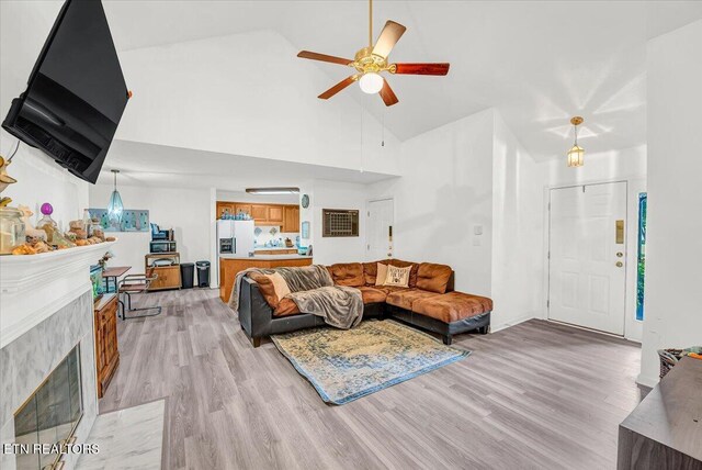 4802 Beverly Field Way, Knoxville, TN 37918 - living room with high vaulted ceiling, a ceiling fan, light wood finished floors, and a tile fireplace