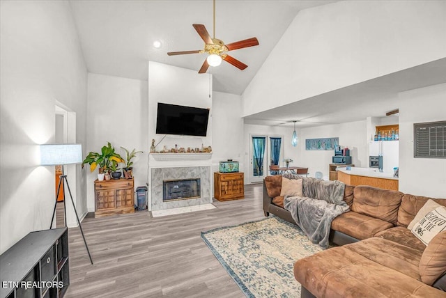 4802 Beverly Field Way, Knoxville, TN 37918 - living area with high vaulted ceiling, a ceiling fan, a high end fireplace, and light wood-style flooring