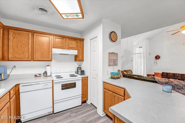 4802 Beverly Field Way, Knoxville, TN 37918 - kitchen featuring white appliances, under cabinet range hood, light wood finished floors, light countertops, and open floor plan