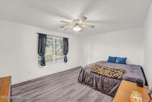 4802 Beverly Field Way, Knoxville, TN 37918 - bedroom featuring wood finished floors, a textured ceiling, and ceiling fan