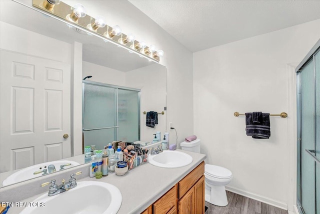 4802 Beverly Field Way, Knoxville, TN 37918 - bathroom with a stall shower, double vanity, and wood finished floors