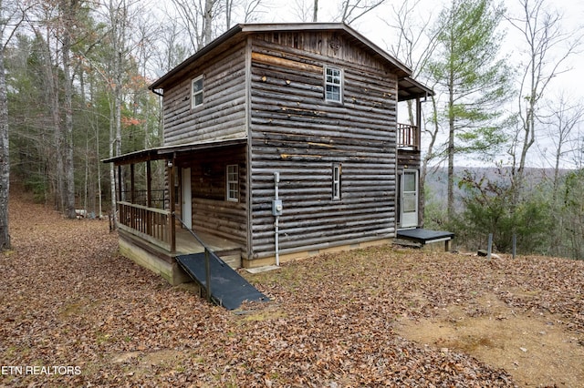 1855 Catoosa Rd, Wartburg, TN 37887 - view of home's exterior featuring log veneer siding and a balcony
