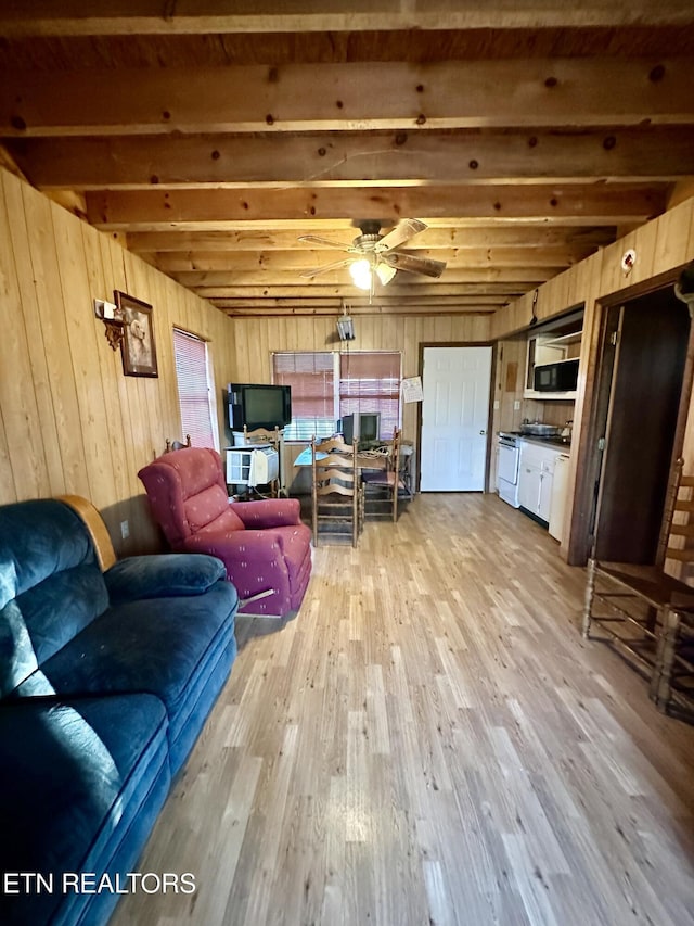 1855 Catoosa Rd, Wartburg, TN 37887 - living area with light wood finished floors, ceiling fan, and wood walls