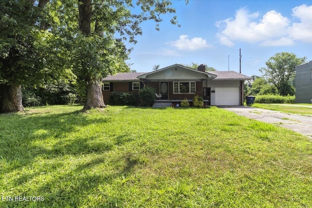 428 Wilderness Rd, Middlesboro, KY 40965 - ranch-style house featuring an attached garage, driveway, and a front lawn