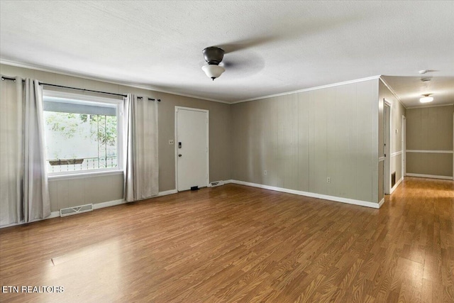 428 Wilderness Rd, Middlesboro, KY 40965 - spare room with ornamental molding, wood finished floors, and a ceiling fan