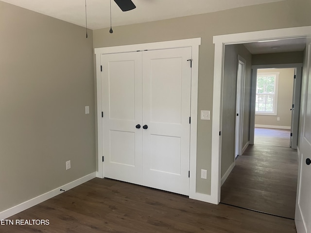 1112 Whispering Pine Ln, Jamestown, TN 38556 - unfurnished bedroom with dark wood finished floors, a closet, and ceiling fan