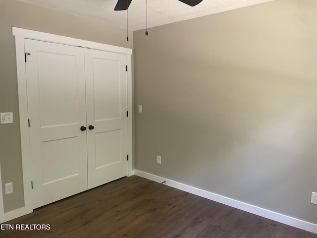 1112 Whispering Pine Ln, Jamestown, TN 38556 - unfurnished bedroom featuring dark wood-style flooring, a closet, and ceiling fan