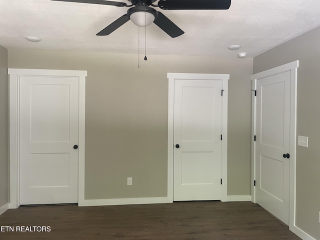 1112 Whispering Pine Ln, Jamestown, TN 38556 - unfurnished bedroom with dark wood finished floors, a ceiling fan, and a textured ceiling