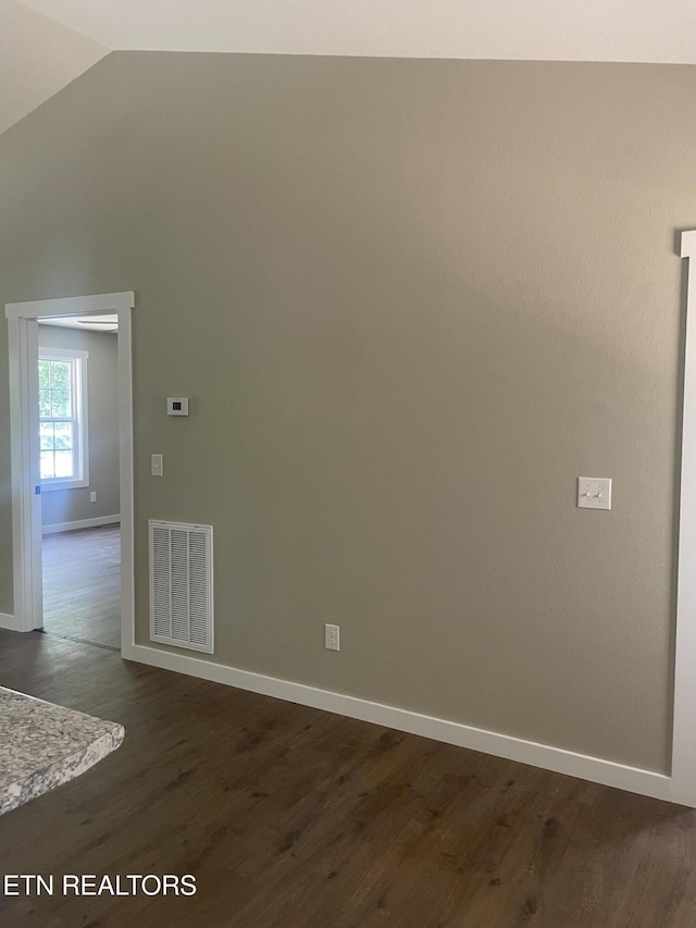 1112 Whispering Pine Ln, Jamestown, TN 38556 - unfurnished room with vaulted ceiling and dark wood finished floors