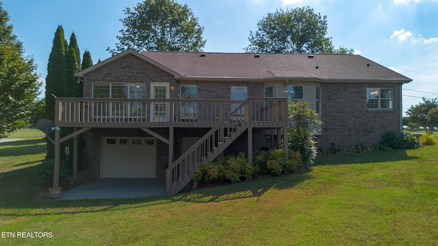 185 Florence Cir, Dandridge, TN 37725 - back of house with brick siding, a wooden deck, and a yard