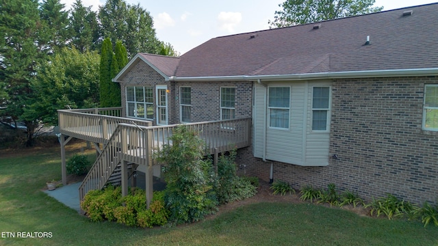 185 Florence Cir, Dandridge, TN 37725 - rear view of house with a deck, stairs, brick siding, a lawn, and a shingled roof