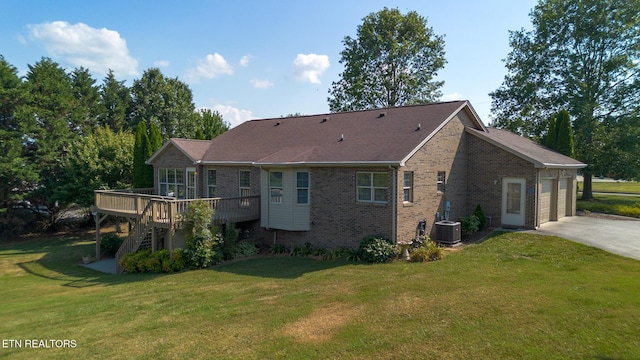 185 Florence Cir, Dandridge, TN 37725 - rear view of house featuring a deck, driveway, brick siding, a lawn, and stairs