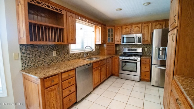 185 Florence Cir, Dandridge, TN 37725 - kitchen with appliances with stainless steel finishes, brown cabinetry, and decorative backsplash