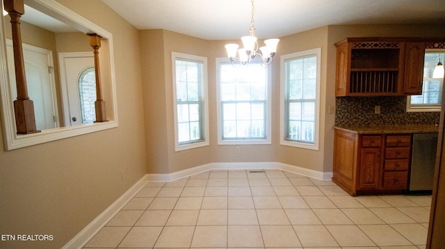 185 Florence Cir, Dandridge, TN 37725 - unfurnished dining area featuring a chandelier and light tile patterned floors