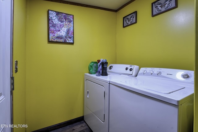 1872 Mitchell Farm Rd, Sevierville, TN 37876 - laundry area featuring washer and dryer, crown molding, and dark wood finished floors