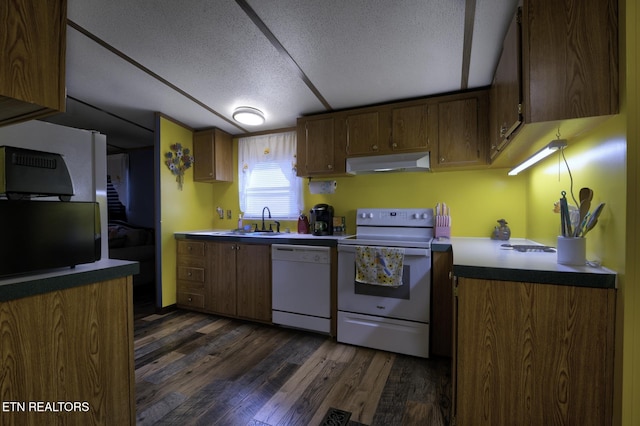 1872 Mitchell Farm Rd, Sevierville, TN 37876 - kitchen with white appliances, under cabinet range hood, a textured ceiling, and dark wood finished floors